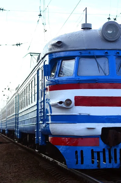 Old soviet electric train with outdated design moving by rail — Stock Photo, Image