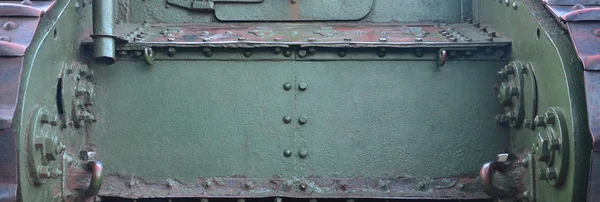 Texture of tank side wall, made of metal and reinforced with a multitude of bolts and rivets — Stock Photo, Image