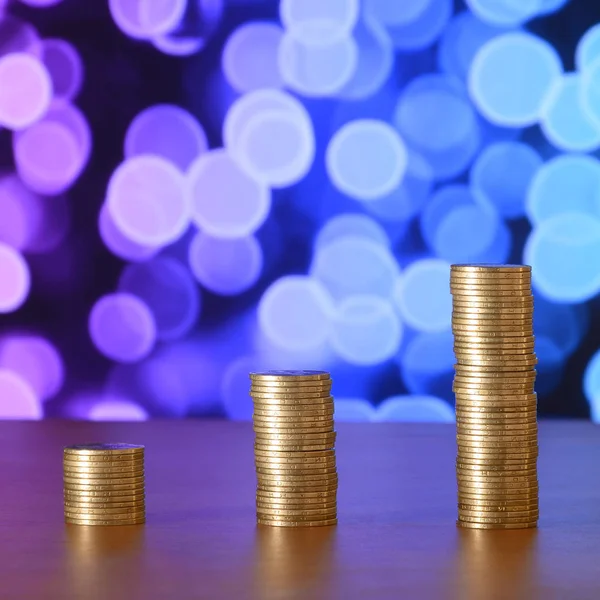 Golden coin stacks arranged as a graph. Increasing columns of coins