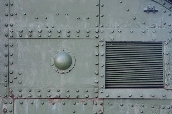 Abstract green industrial metal textured background with rivets and bolts