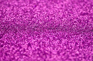 Pembe dekoratif payetler. Küçük öğelerden parlak bokeh ışıkları ile arka plan görüntüsü