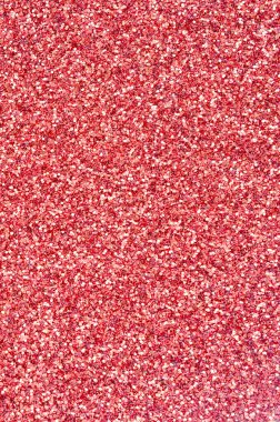 Mercan kırmızısı dekoratif payetler. Küçük öğelerden parlak bokeh ışıkları ile arka plan görüntüsü