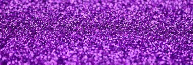Mor dekoratif payetler. Küçük öğelerden parlak bokeh ışıkları ile arka plan görüntüsü