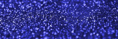 Mavi dekoratif payetler. Küçük öğelerden parlak bokeh ışıkları ile arka plan görüntüsü