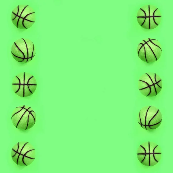 Many small green balls for basketball sport game lies on texture background — Stock Photo, Image