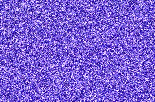 Violette dekorative Pailletten. Hintergrundbild mit glänzenden Bokeh-Lichtern aus kleinen Elementen — Stockfoto