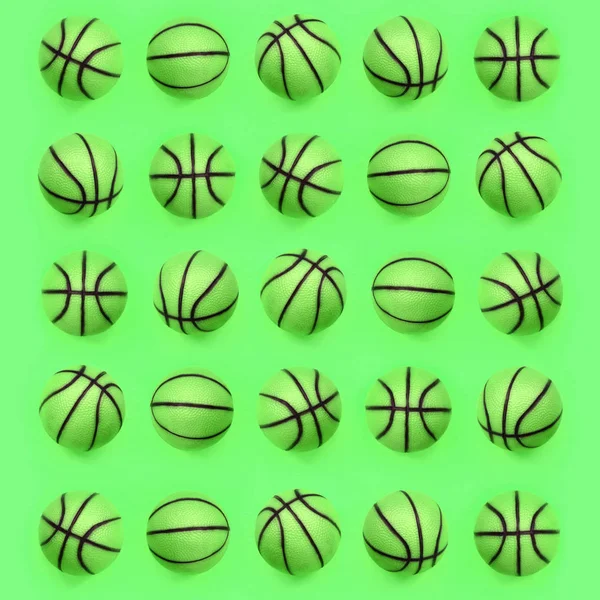 Many small green balls for basketball sport game lies on texture background — Stock Photo, Image