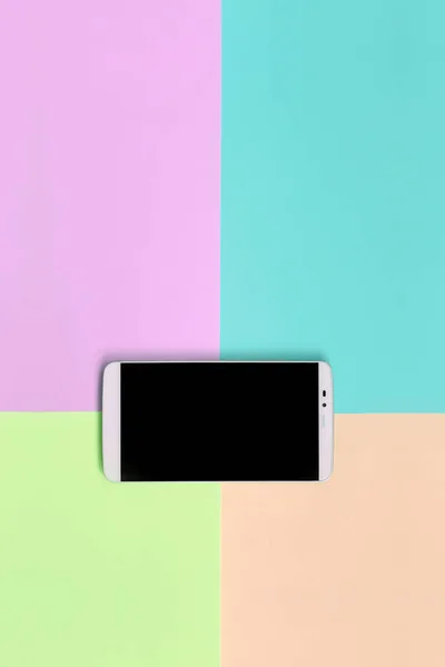 Modern smartphone with black screen on texture background of fashion pastel pink, blue, coral and lime colors