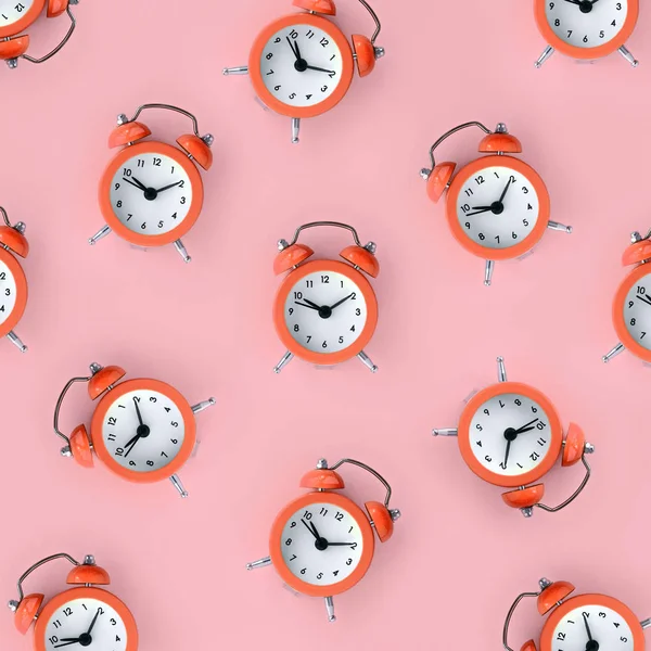 Wasting time concept. Many coral red alarm clock — Stock Photo, Image