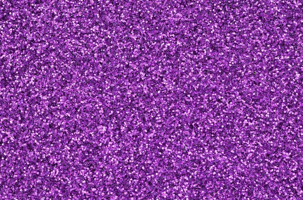 Paillettes decorative viola. Immagine di sfondo con luci bokeh lucide da piccoli elementi — Foto Stock