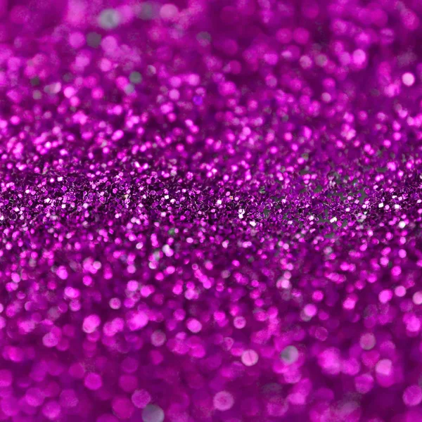 Pink decorative sequins. Background image with shiny bokeh lights from small elements