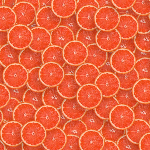 Pattern of red grapefruit citrus slices. Citrus flat lay