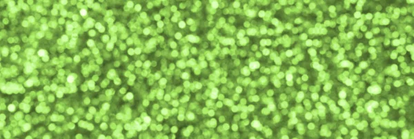 Sfocato verde lime decorativi paillettes. Immagine di sfondo con luci bokeh lucide da piccoli elementi — Foto Stock
