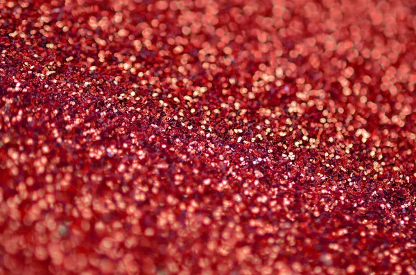 Bíbor piros dekoratív flitter. Háttérkép fényes bokeh fények kis elemek — Stock Fotó