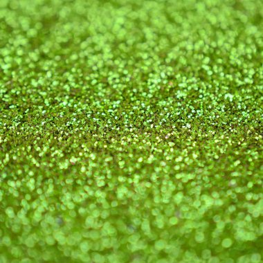 Kireç yeşili dekoratif payetler. Küçük öğelerden parlak bokeh ışıkları ile arka plan görüntüsü