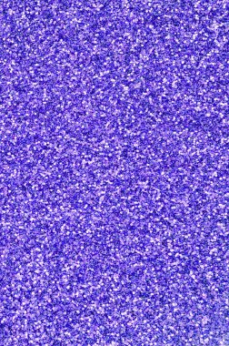 Menekşe dekoratif payetler. Küçük öğelerden parlak bokeh ışıkları ile arka plan görüntüsü