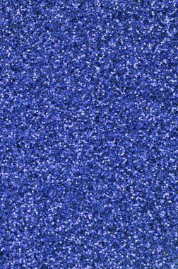 Mavi dekoratif payetler. Küçük öğelerden parlak bokeh ışıkları ile arka plan görüntüsü