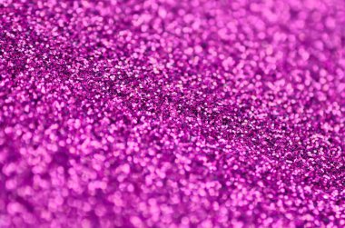 Pembe dekoratif payetler. Küçük öğelerden parlak bokeh ışıkları ile arka plan görüntüsü