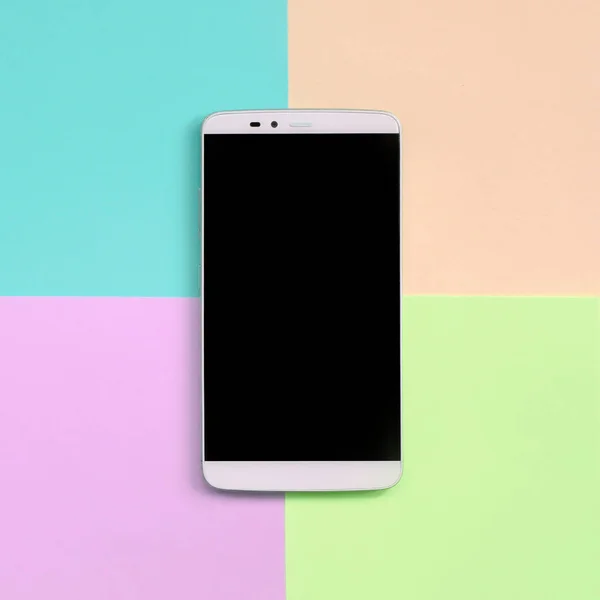 Modern smartphone with black screen on texture background of fashion pastel pink, blue, coral and lime colors
