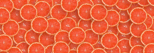 Образец красных грейпфрутовых ломтиков цитрусовых. Цитрусовая ткань — стоковое фото
