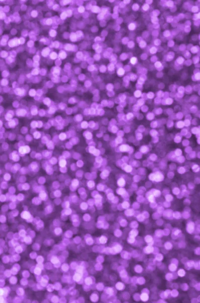 Sfocate paillettes decorative viola. Immagine di sfondo con luci bokeh lucide da piccoli elementi — Foto Stock