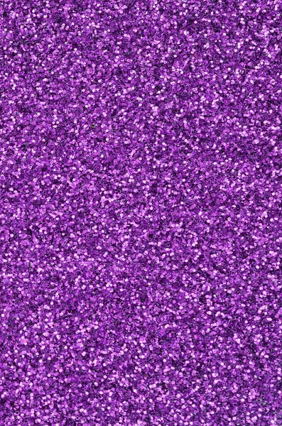 紫色の装飾的なスパンコール。小さな要素から光沢のあるボケライトを持つ背景画像 — ストック写真
