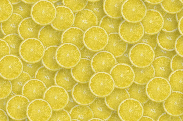 Pattern of yellow lemon citrus slices. Citrus flat lay