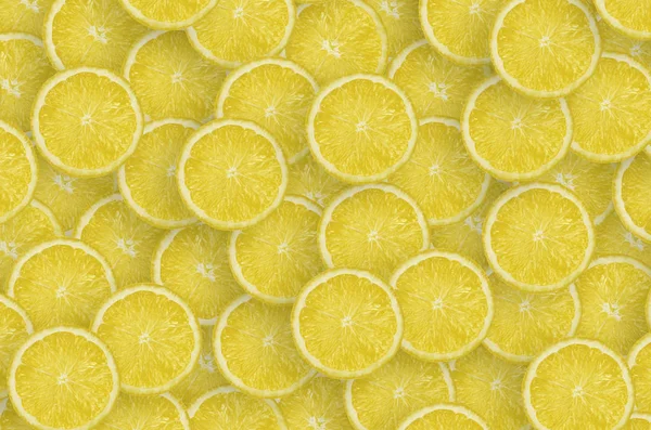 Pattern of yellow lemon citrus slices. Citrus flat lay