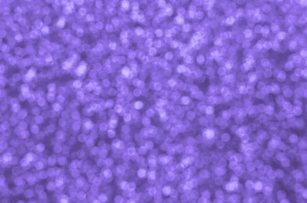 Sfocate paillettes decorative viola. Immagine di sfondo con luci bokeh lucide da piccoli elementi — Foto Stock