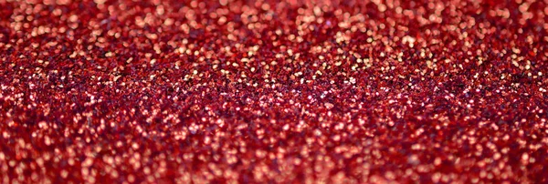 Karmínově zbarvené ozdobné sekty. Obrázek pozadí s lesklými bokeh z malých prvků — Stock fotografie