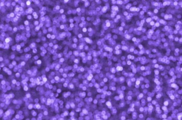 Sfocate paillettes decorative viola. Immagine di sfondo con luci bokeh lucide da piccoli elementi — Foto Stock