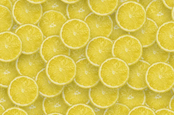黄色のレモン柑橘類のスライスのパターン。シトラスフラットレイ — ストック写真