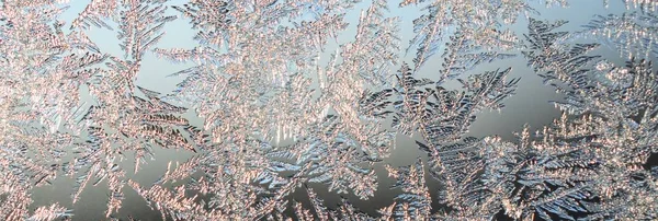 Snowflakes frost rime macro on window glass pane — Stock Photo, Image