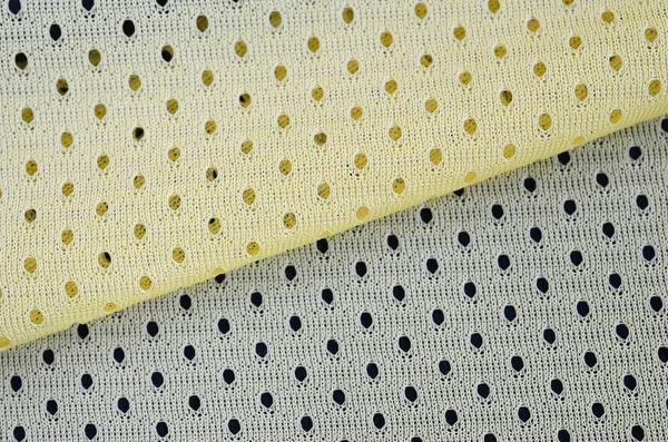 Olahraga jala kuning memakai latar belakang pola tekstil kain — Stok Foto