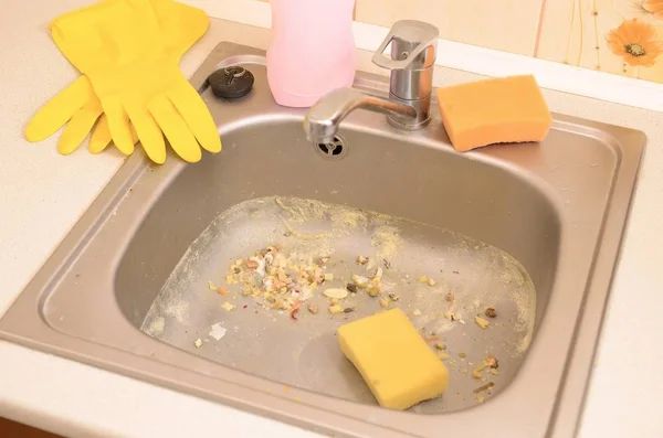 Close up on dirty clogging kitchen sink drain with food particles — Stock Photo, Image