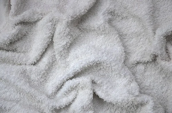 Vit naturlig bomull handduk bakgrund textur med många veck — Stockfoto