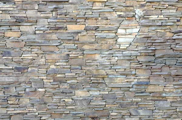 Σύγχρονο μοτίβο του ισοπέδωση πέτρα τοίχο διακοσμητικές επιφάνειες στο φρύδι — Φωτογραφία Αρχείου