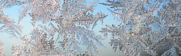 Snowflakes frost rime macro on window glass pane — Stock Photo, Image