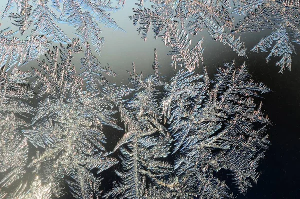 Snowflakes frost rime macro on window glass pane — Stock Photo, Image