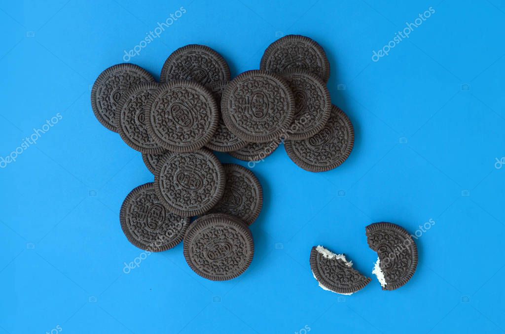 KHARKOV, UKRAINE - SEPTEMBER 8, 2019: Many OREO sandwich cream biscuits on blue background. Oreo is a sandwich cookie with a sweet cream is the best selling cookie in the US