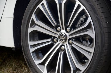 Toyota corolla wheel with dunlop sport maxx tires and aluminium rims clipart