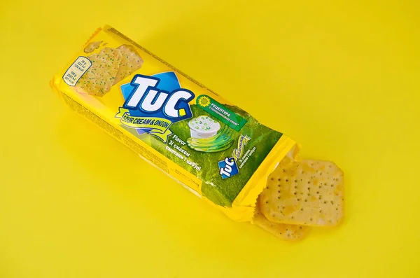 stock image Tuc snack pack on bright yellow flat background