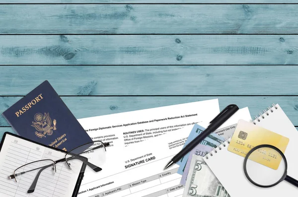 Department of State form DS4139 Signature card lies on table and ready to fill. Paperwork during operations with US Passport concept. Flat lay top view