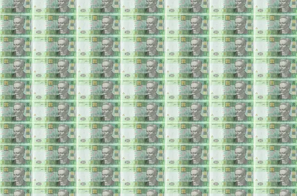 20份乌克兰格里夫尼亚钞票印在货币生产传送机上 许多帐单的拼凑 货币通货膨胀和货币贬值的概念 — 图库照片