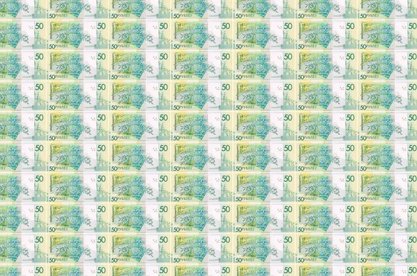 50白俄罗斯卢布 印在货币生产传送机上 许多帐单的拼凑 货币通货膨胀和货币贬值的概念 — 图库照片