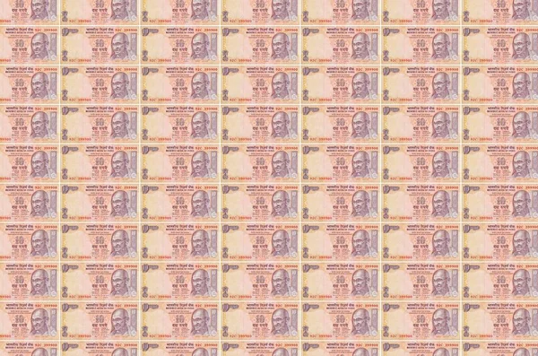 10印在货币生产传送机上的印度卢比 许多帐单的拼凑 货币通货膨胀和货币贬值的概念 — 图库照片
