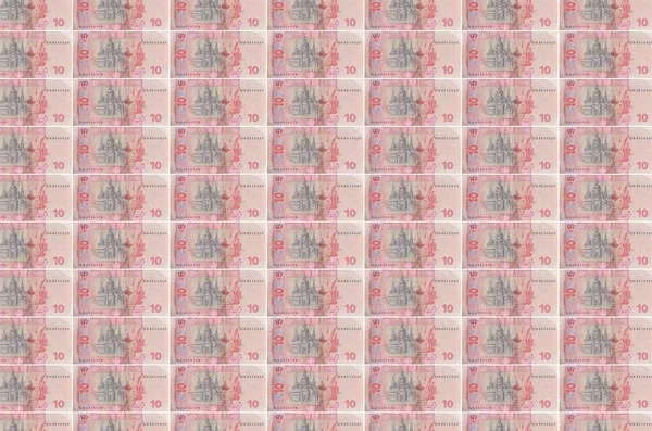 10お金の生産コンベアに印刷されたウクライナのフリブニア法案 多くの請求書のコラージュ 通貨のインフレと切り下げの概念 — ストック写真