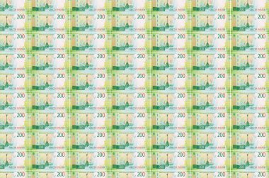 200 Rus rublesi para üretim konveyöründe basıldı. Bir sürü banknotun kolajı. Para birimi enflasyonu ve devalüasyon kavramı
