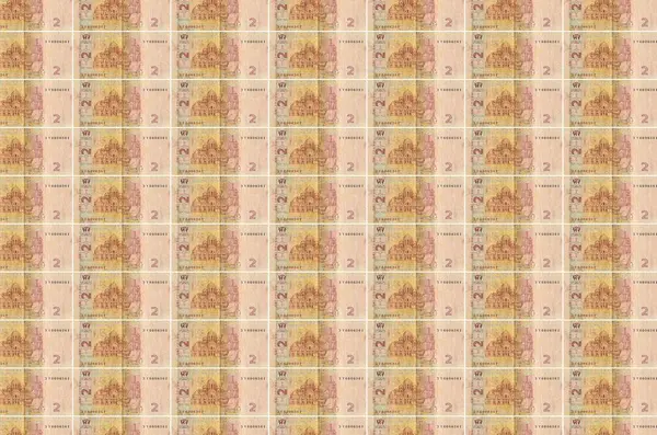 2印在货币生产传送机上的乌克兰格里夫尼亚钞票 许多帐单的拼凑 货币通货膨胀和货币贬值的概念 — 图库照片