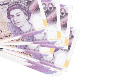 20 İngiliz sterlinli banknotlar küçük gruplar halinde ya da beyaz paketler halinde uzanıyor. Kopyalama alanı olan bir model. İş ve para değişimi kavramı
